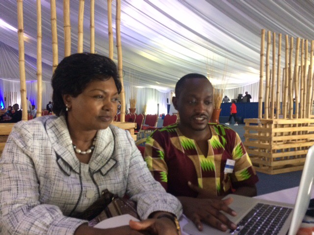 JEAN PAULIN MUTATSINEZA, THE REAP COUNTRY DIRECTOR PRESENTS OUR VISION TO DR. MATHILDE MUKANTABANA, THE AMBASSADOR OF RWANDA TO THE US.