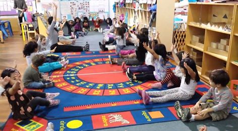 Ayana leading the kids in a movement exercise!