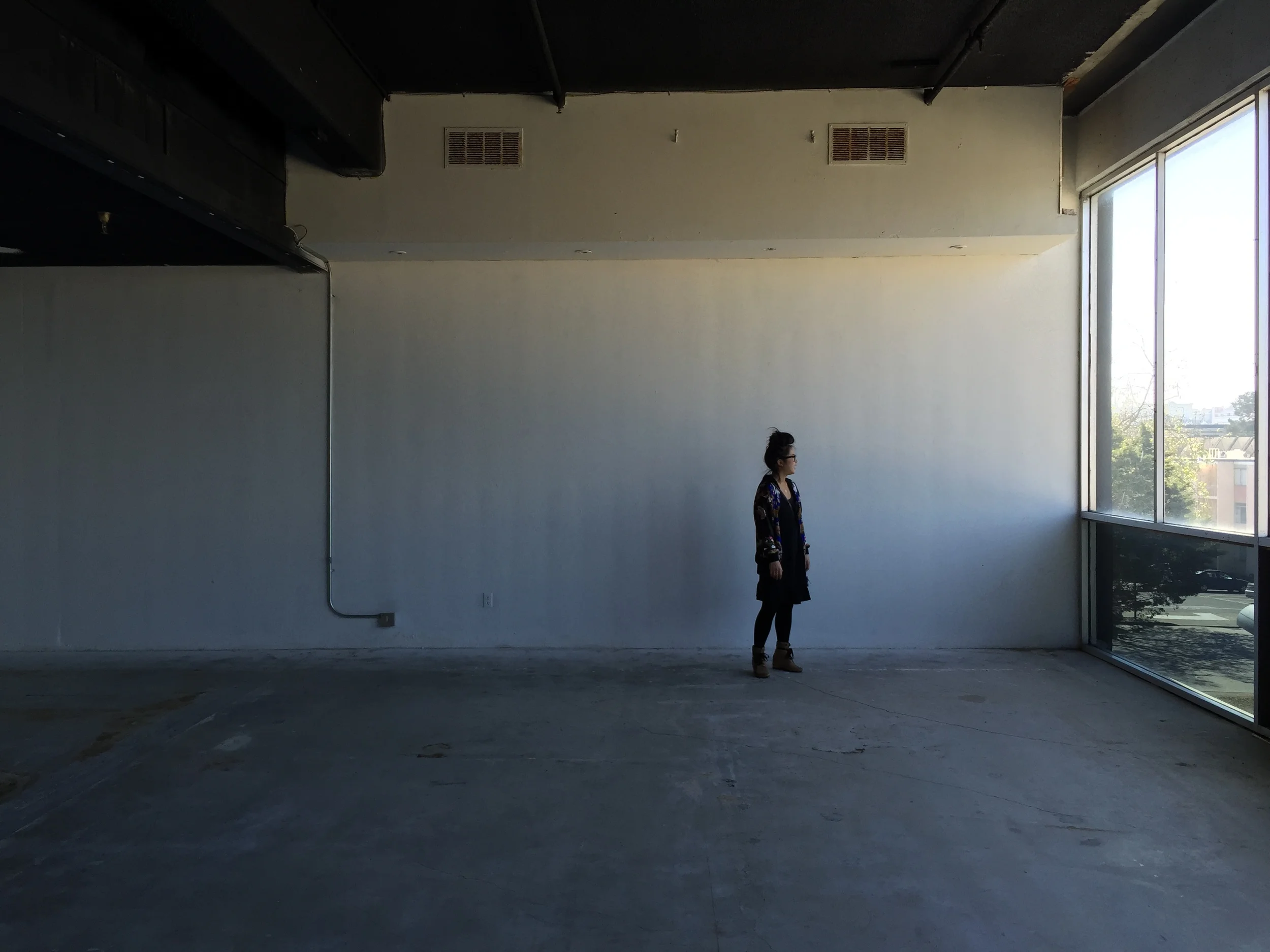 Eryn Kimura standing in our new space