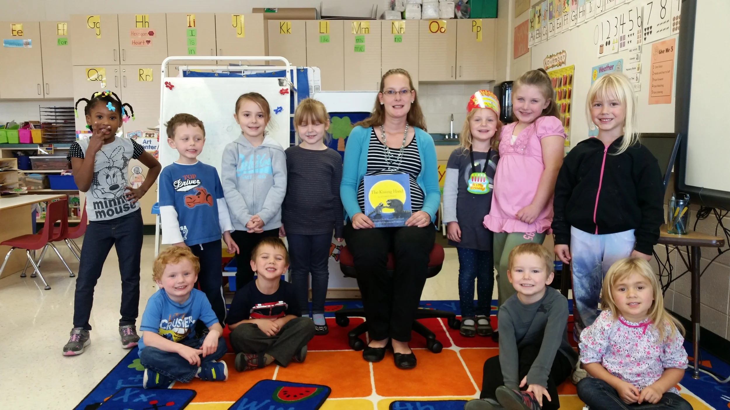 We gave Mrs. Rachel the book, "The Kissing Hand" Everyone signed it so she will always remember our class. 