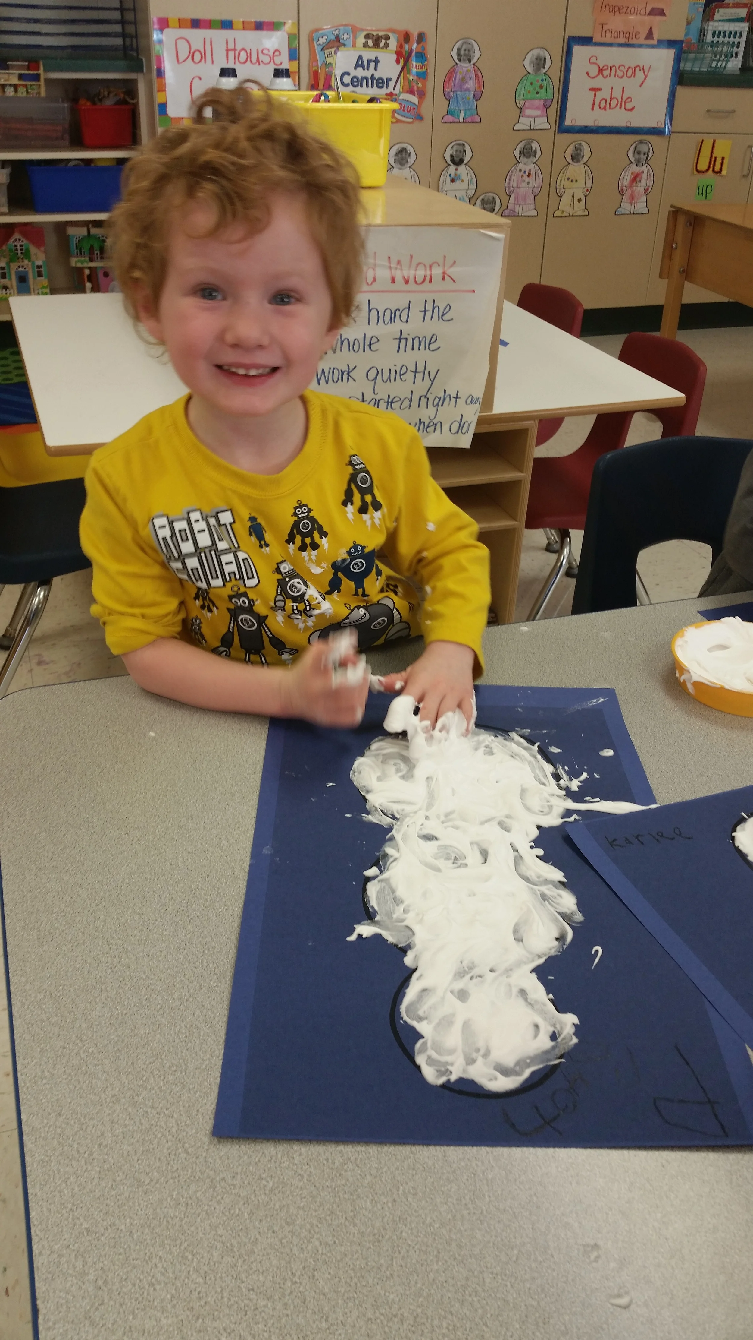 finger painting with a mixture of shaving cream and glue