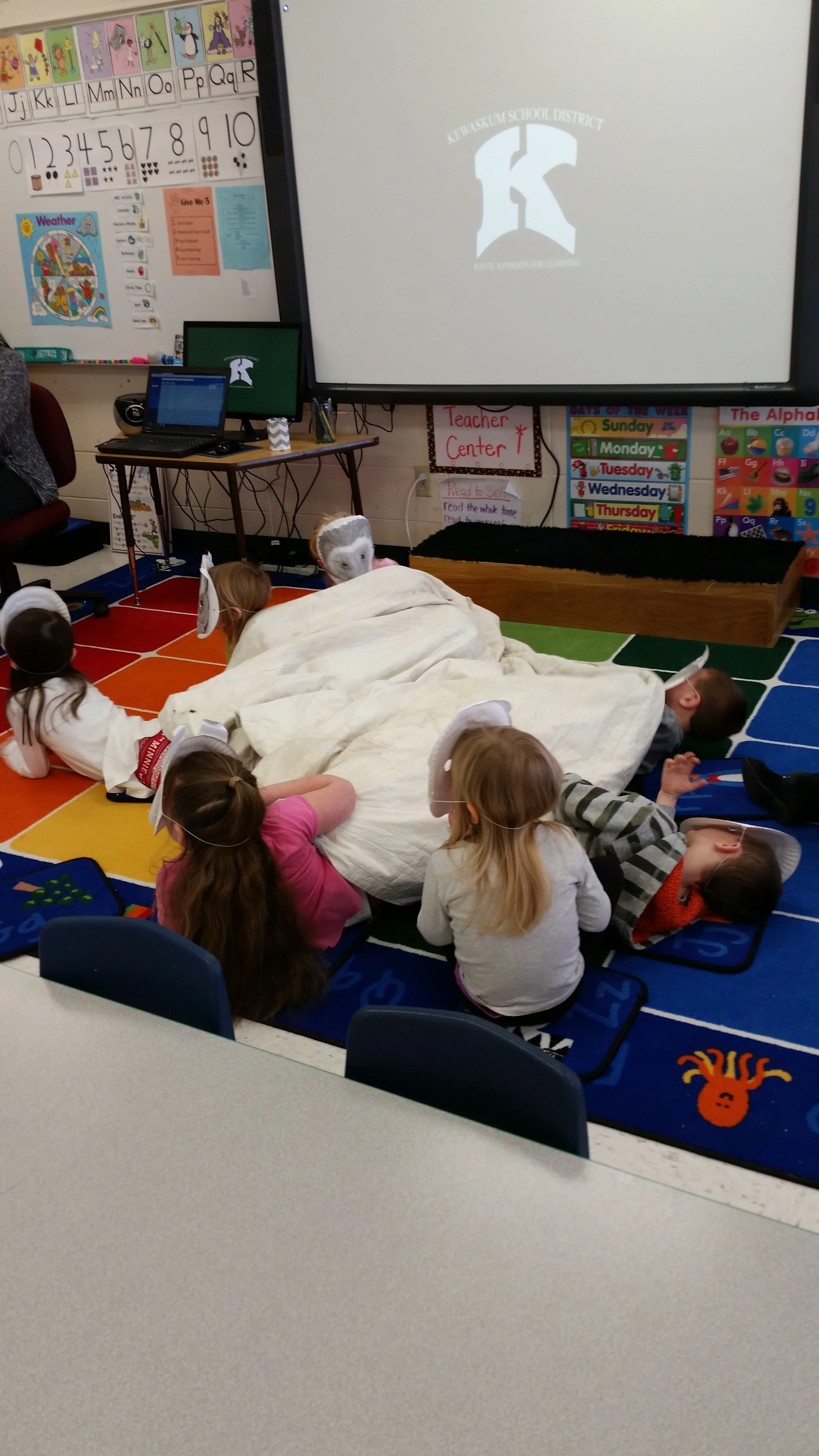The students wore masks of the animals in The Mitten and we acted out the story