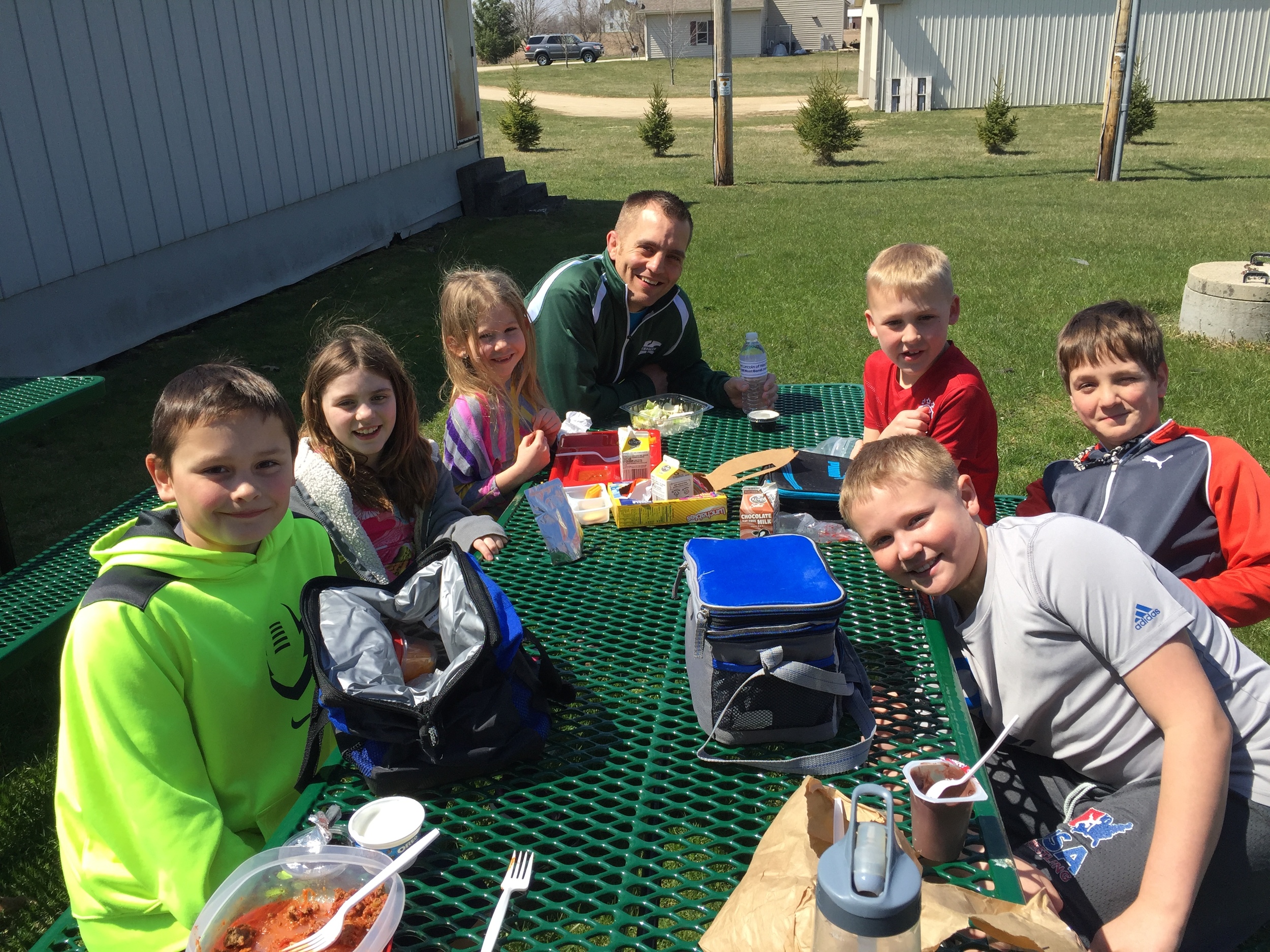 Mr. Dziedzic and the winners of this month's Respect Award eating lunch together outside today. Classroom teachers chose one student per grade level (K-5) to receive this award.