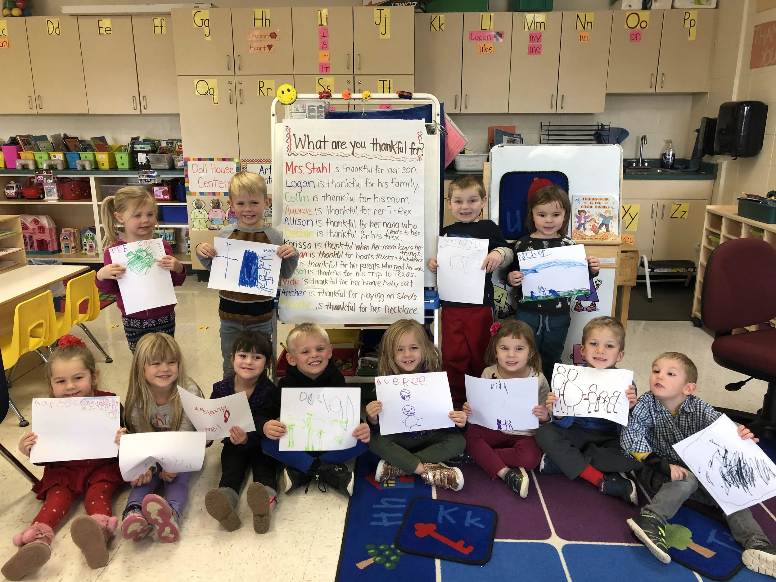 students drew a picture to show something they are each thankful for