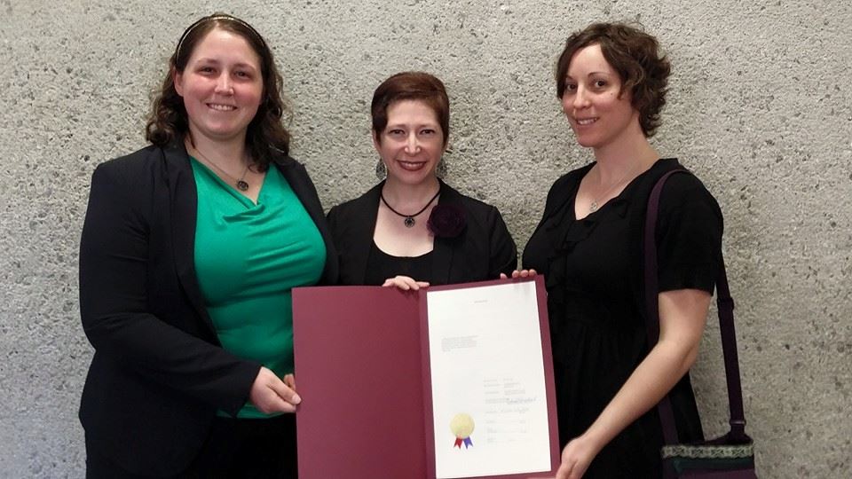 Agent Skaar, Wicked Wench and Space Riot accepted the County Commissioner's resolution honoring the Hard Knox Rollergirls.