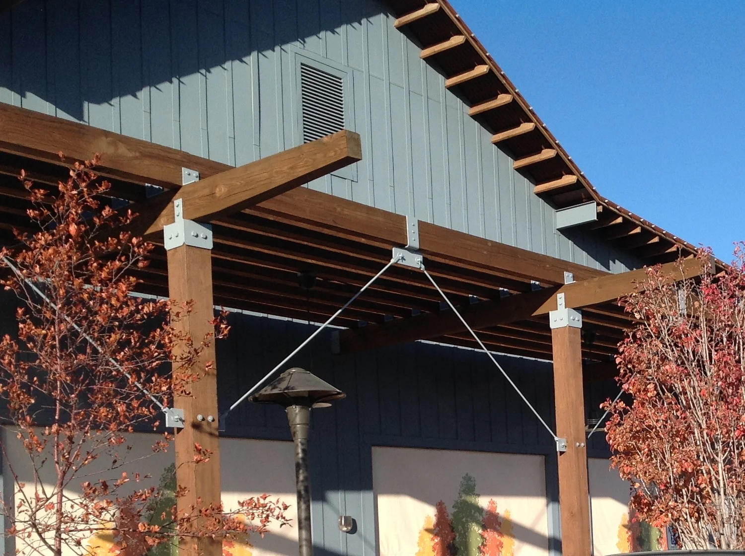 Wood re-staining and detailed bolt/bracket painting with an exterior rust inhibiting product