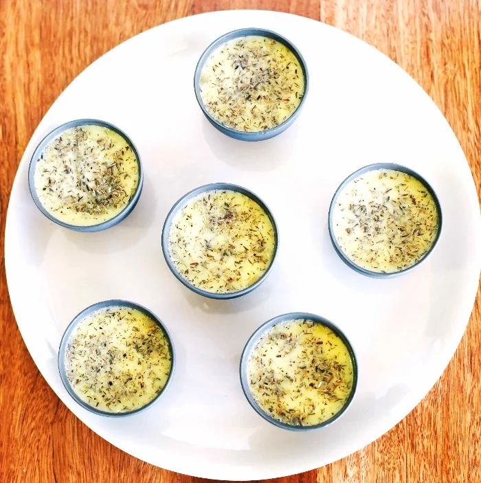 Individual serves of organic pâté in ramekins with herb topping – pasture-raised chicken liver spread