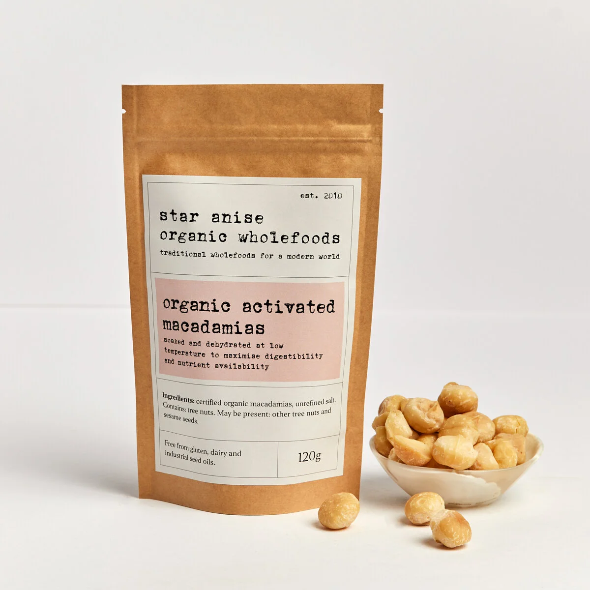 120g bag of organic activated macadamia nuts with whole nuts displayed