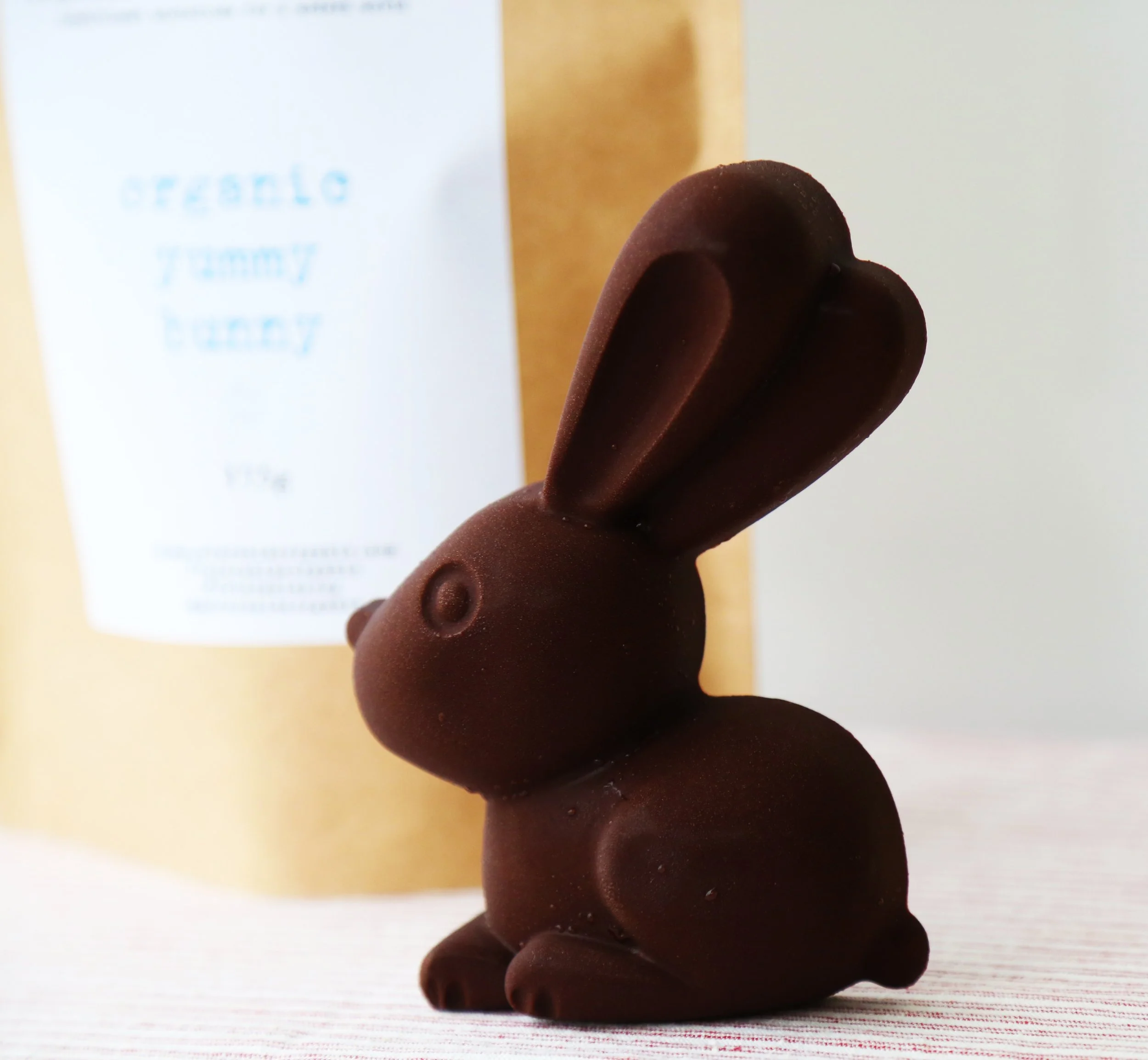 Close-up of solid organic Easter chocolate bunny – crafted with raw cacao and maple syrup