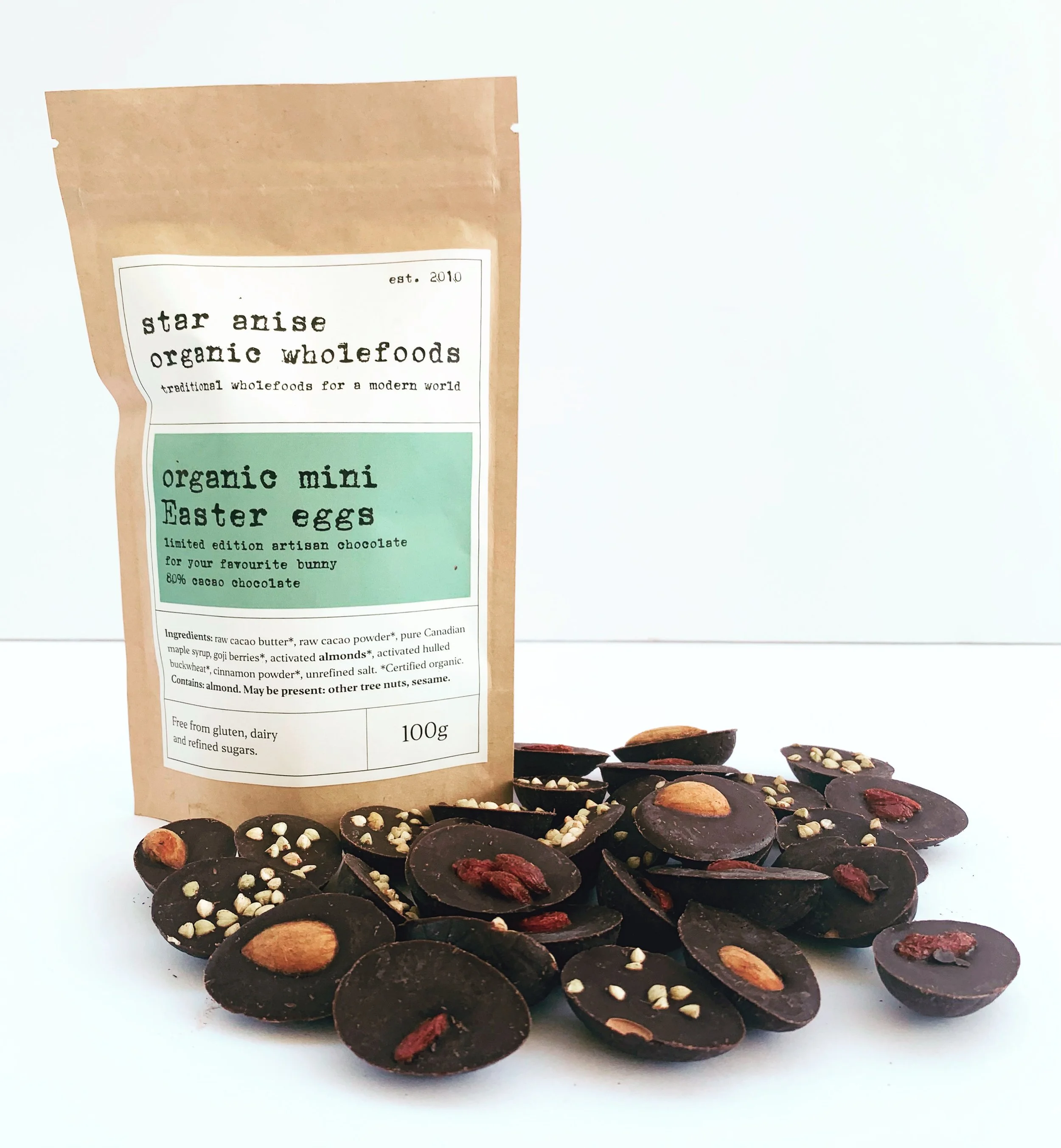 Organic Mini Easter Eggs in kraft pouch with raw chocolate halves – topped with goji, almonds, or cinnamon buckwheat