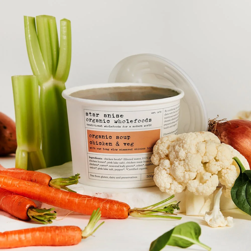 Organic chicken and vegetable soup in container – part of postpartum nourishment pack