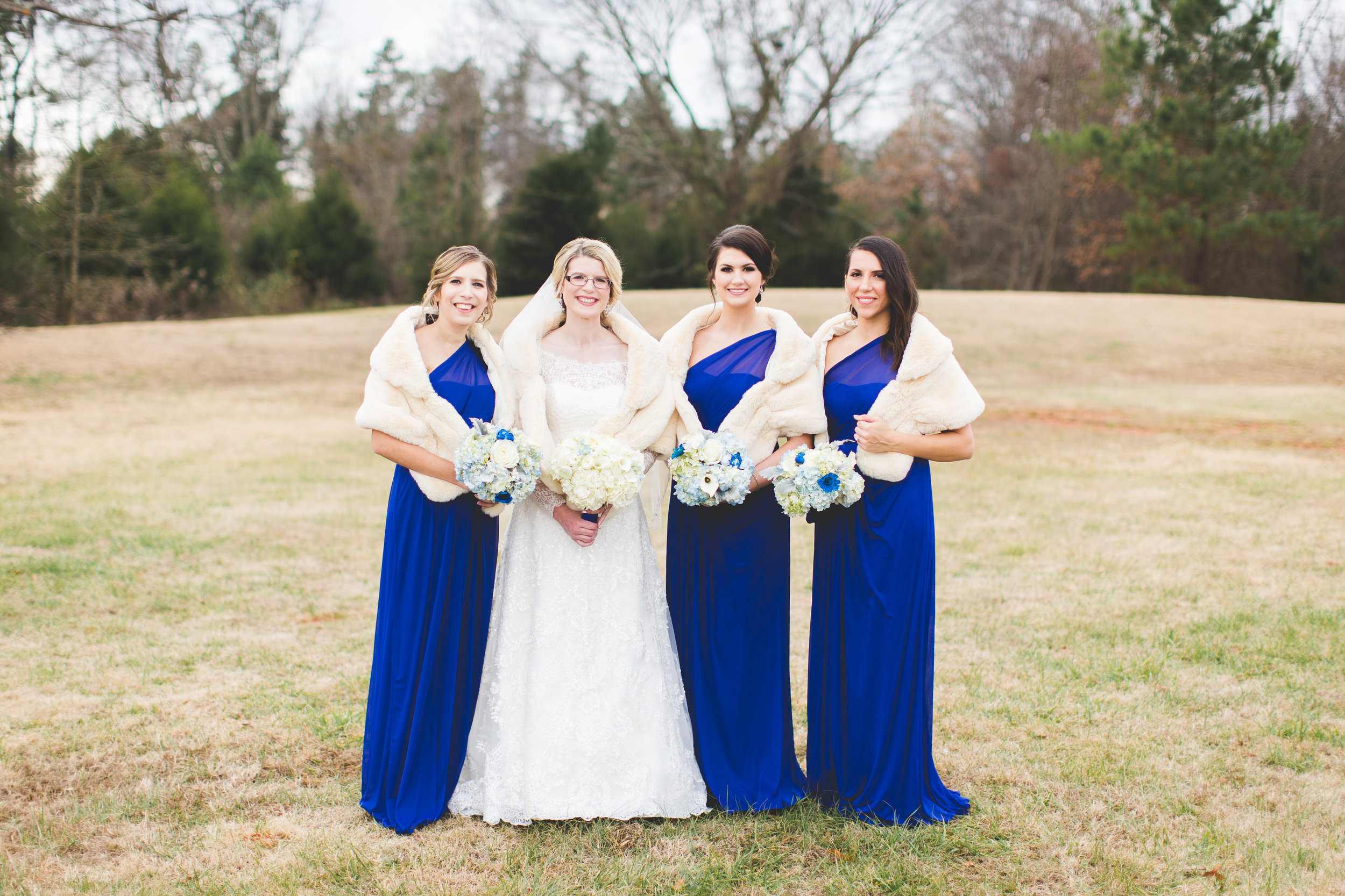 Bridesmaids with fur shawl winter wedding