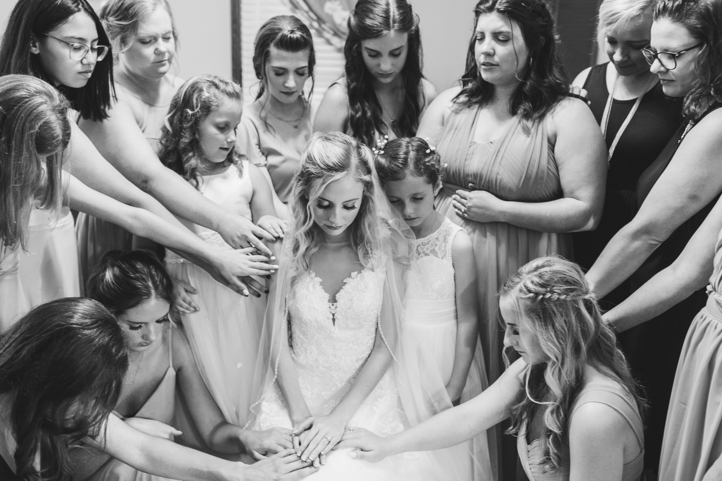 emotional prayer with bridesmaids