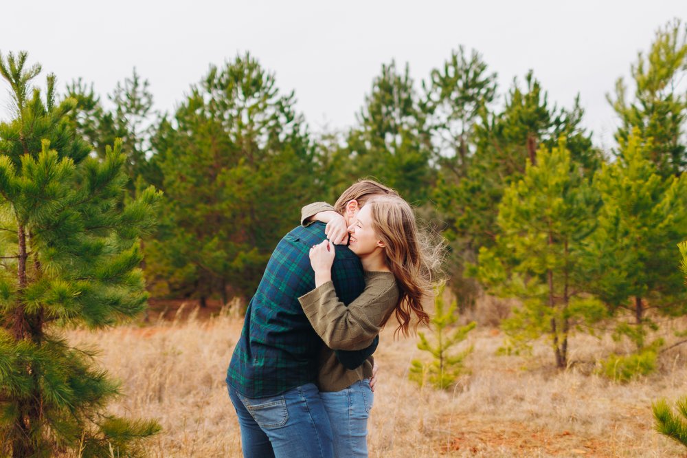 happy hugging engagement portraits