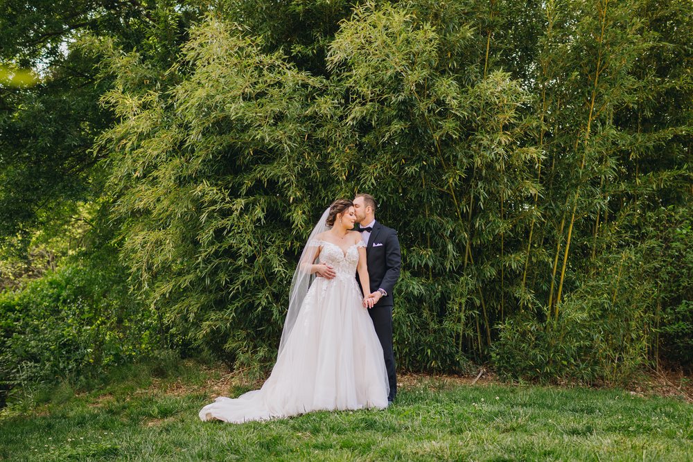 Classy wedding portraits with bamboo backdrop