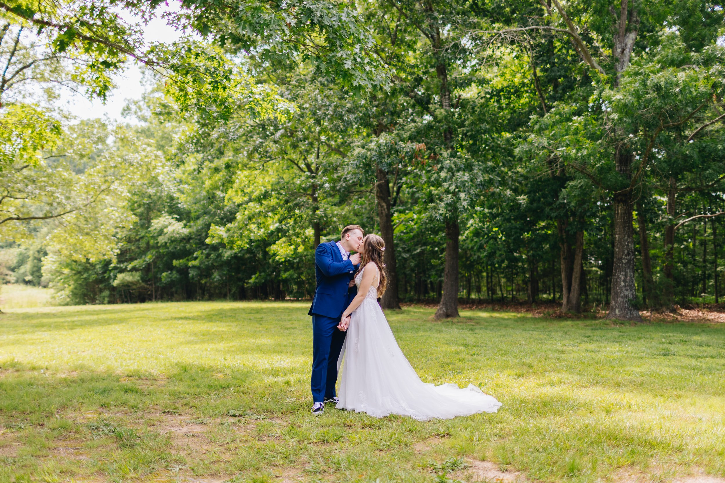 kissing wedding portraits