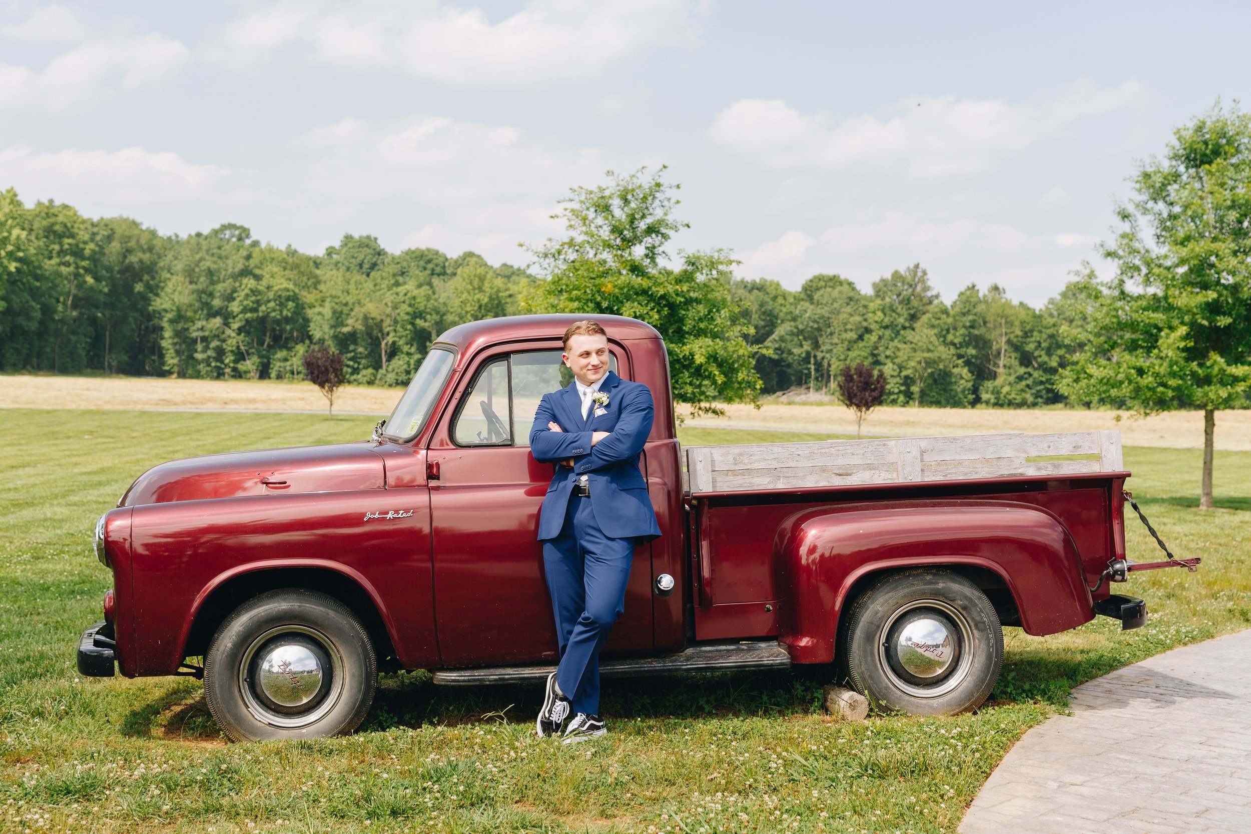 groom with red truck portraits