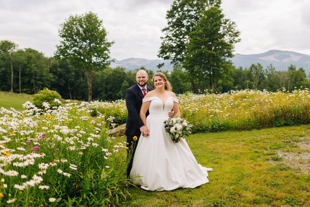 wedding portraits in mountains with wildflowers