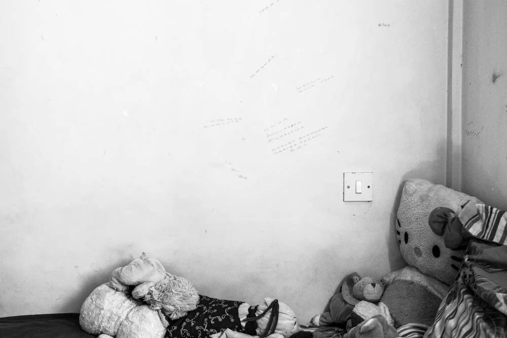 Inscription in different languages on the wall are silently speaking to the hardships of prior tenants. "Insensitivity, heartless, not feeling - Close the eyes, finish the life."