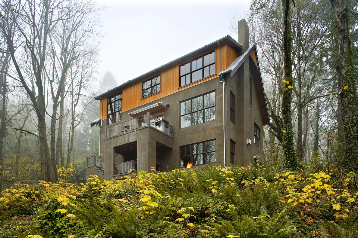 This residence bordered by the scenic Terwilliger Parkway and Marquam Trail System was the first LEED for Homes Gold project in they city of Portland Oregon. It sits between historic and modern stylings in a rustic landscape only minutes away from downtown.