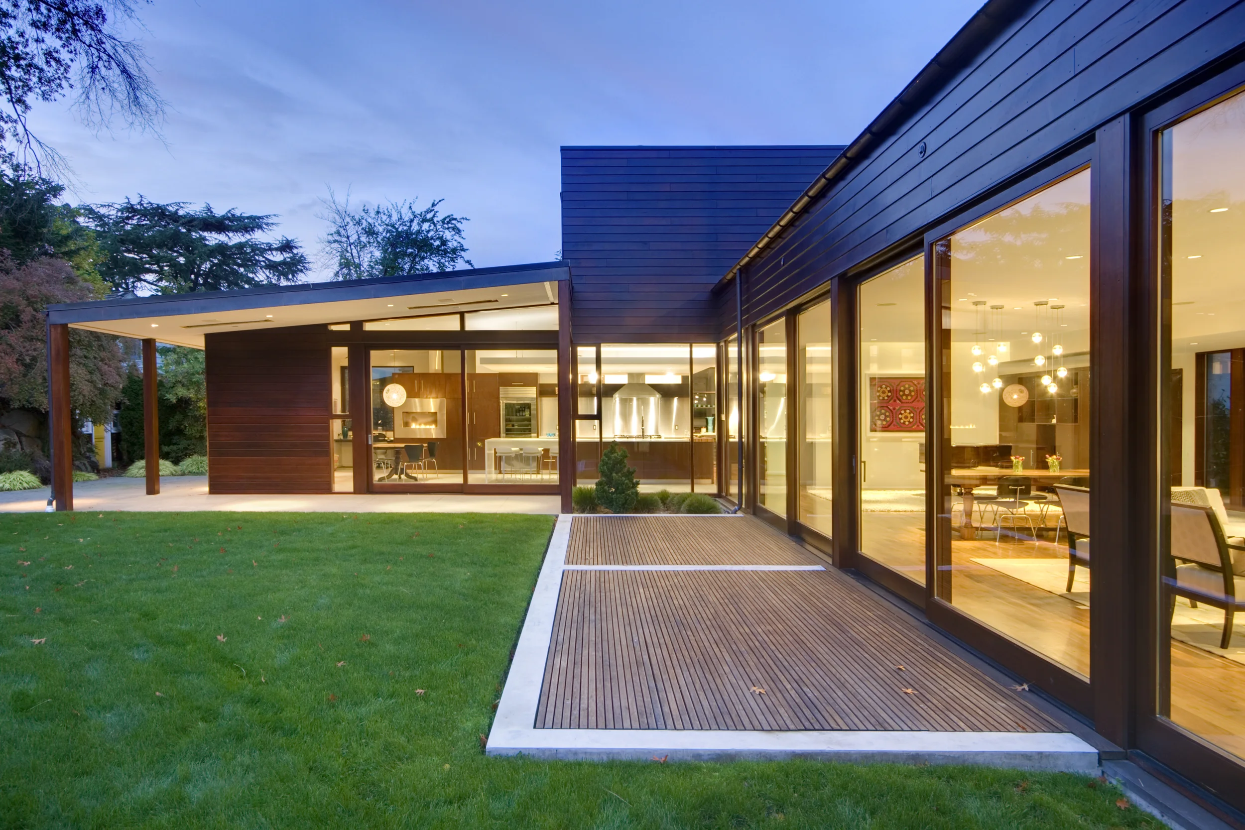 Connection between inside and outside was the primary concept in this residence in addition to adding upstairs bedrooms, reshaping the massing, updating finishes, and giving the home a fresh classic modern feel. Photos by Steve Keating.
