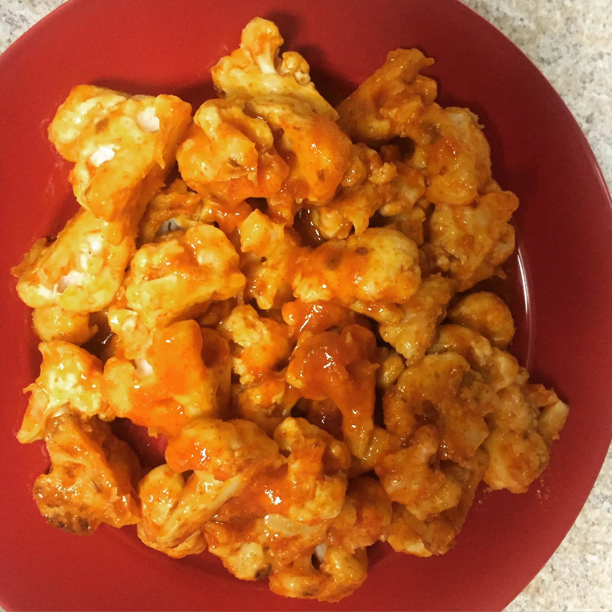 Oven roasted cauliflower with sirracha as a snack - courtesy of Thug Kitchen 