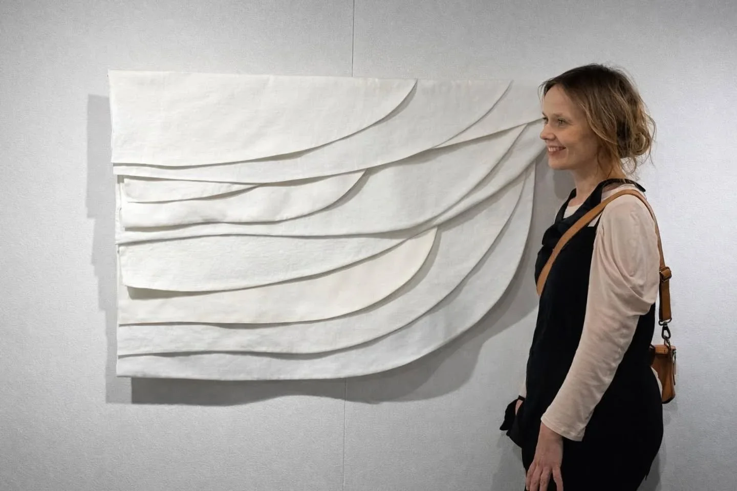 "Traces of touch memory"

This wall hanging is composed of surplus textiles originating from garments made for weddings, funerals, theatre productions, fashion collections, catwalk presentations and prototypes.

All of the materials are whi