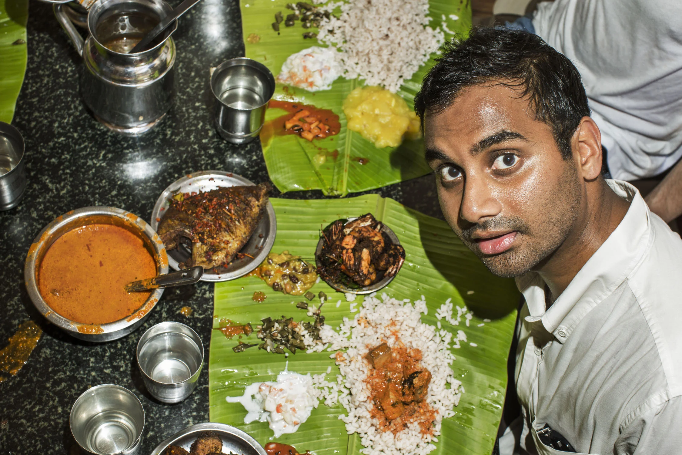 American actor and comedian Aziz Ansari, traveled to India in search of his roots — and tons of 'romba tasty' food.