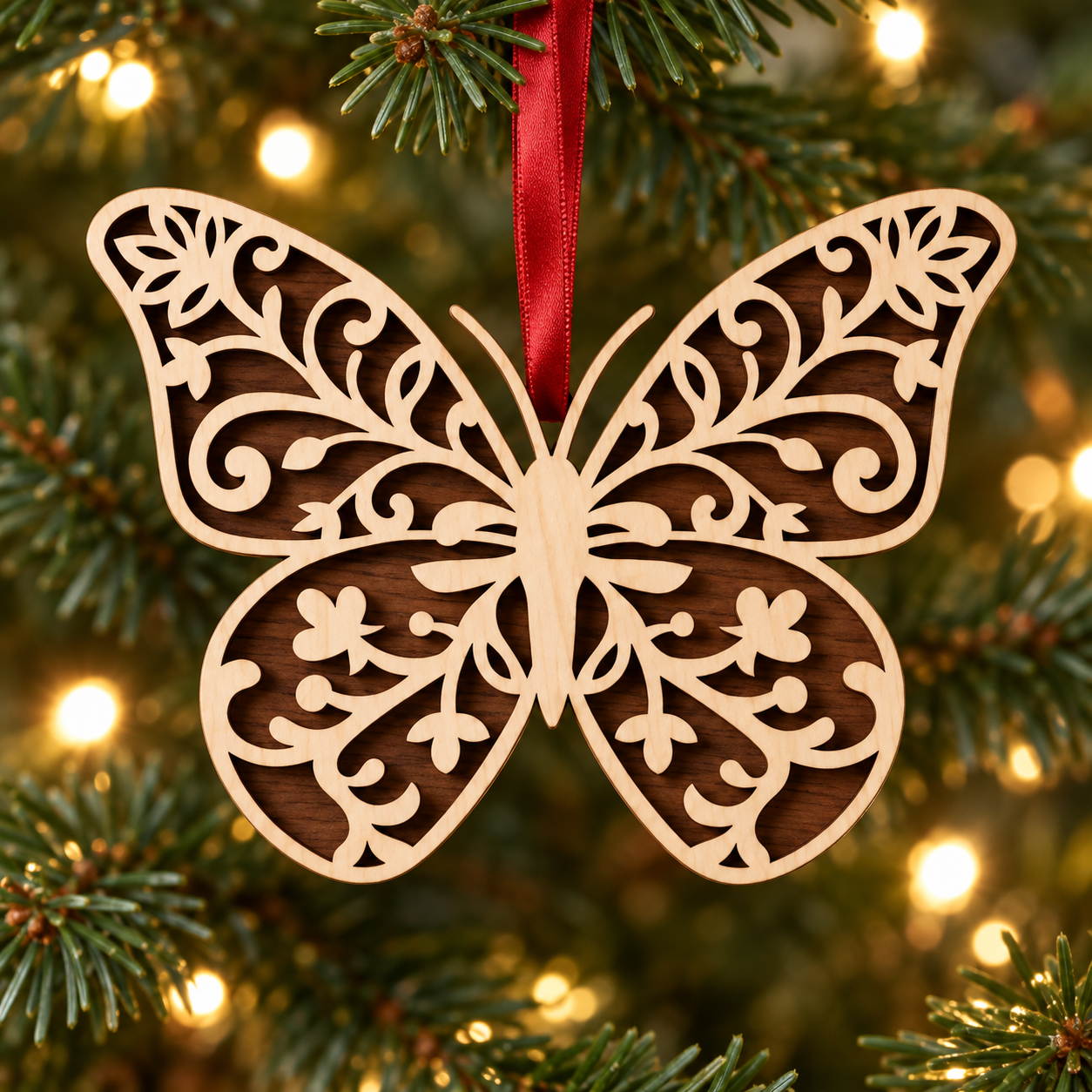 Red-ribbon wooden butterfly Christmas ornament.png