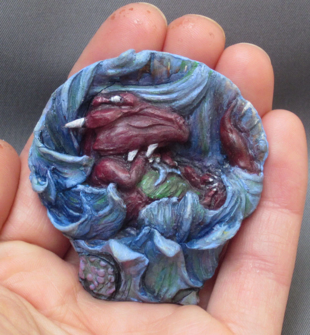 Relief Sculpture tiny dragon in hand.jpg