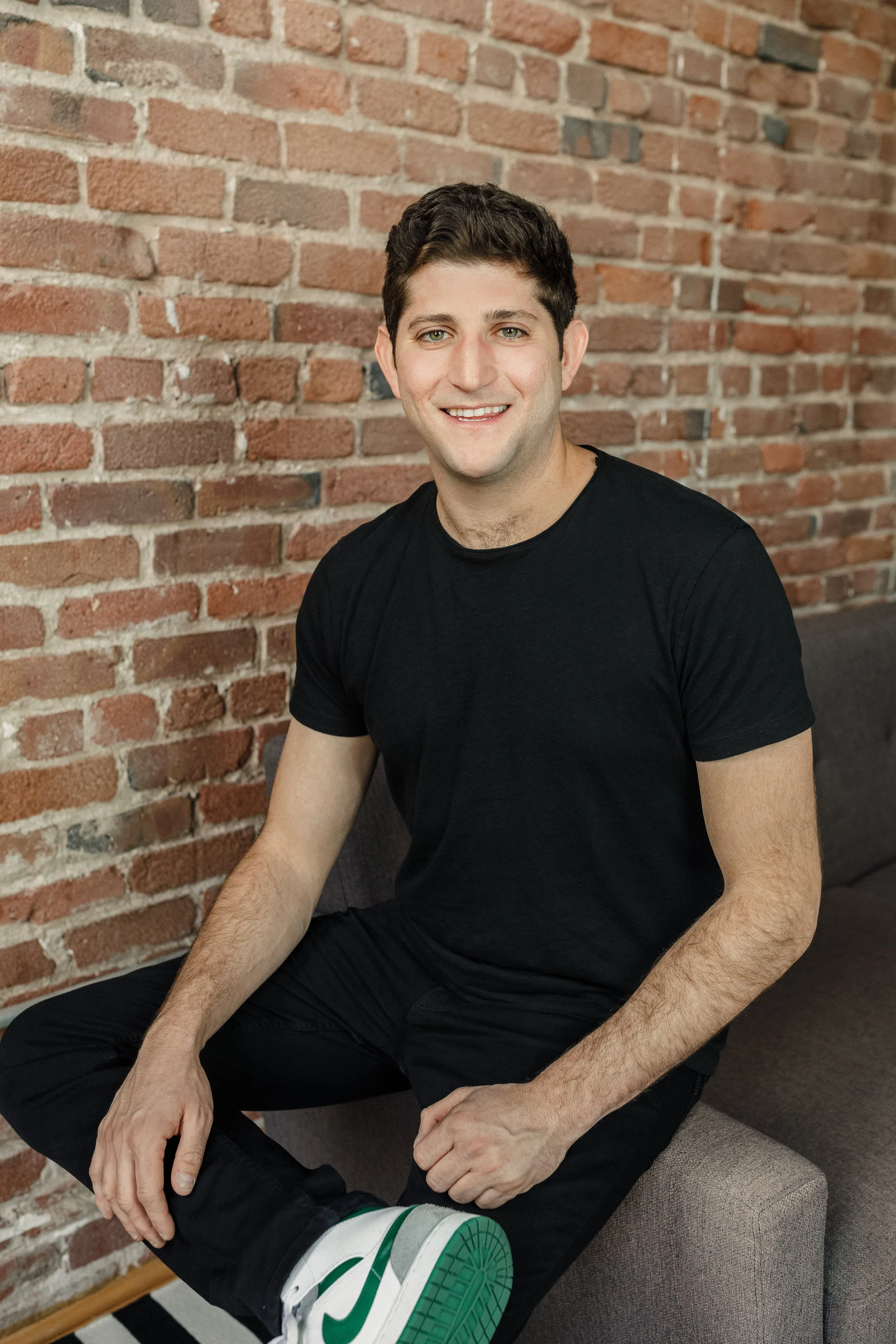 Founder Headshot Brickwall Relaxed.jpg