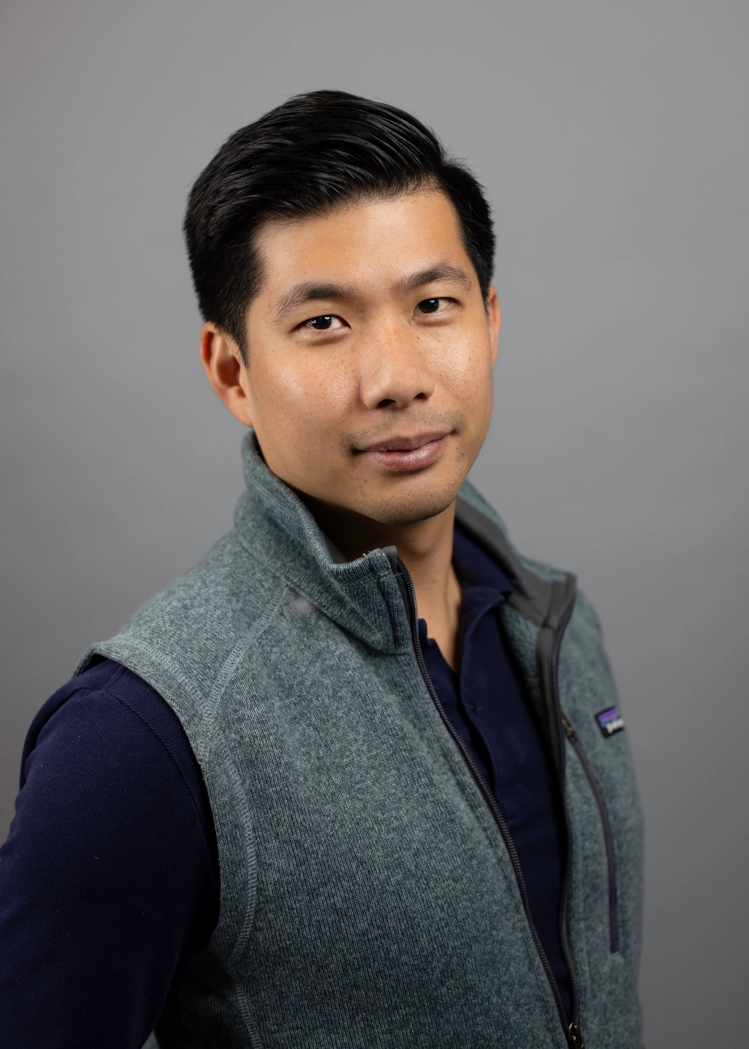 StudioHeadshotGrayBackground.jpg