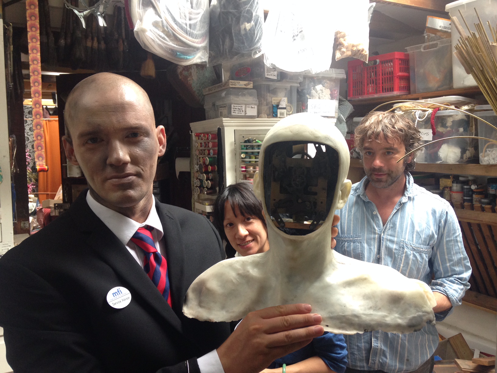 (Left to right, inside Natasha Lawes' studio) Reuben Hollebon, Natasha Lawes, Reuben Hollebon's robot, James Slater