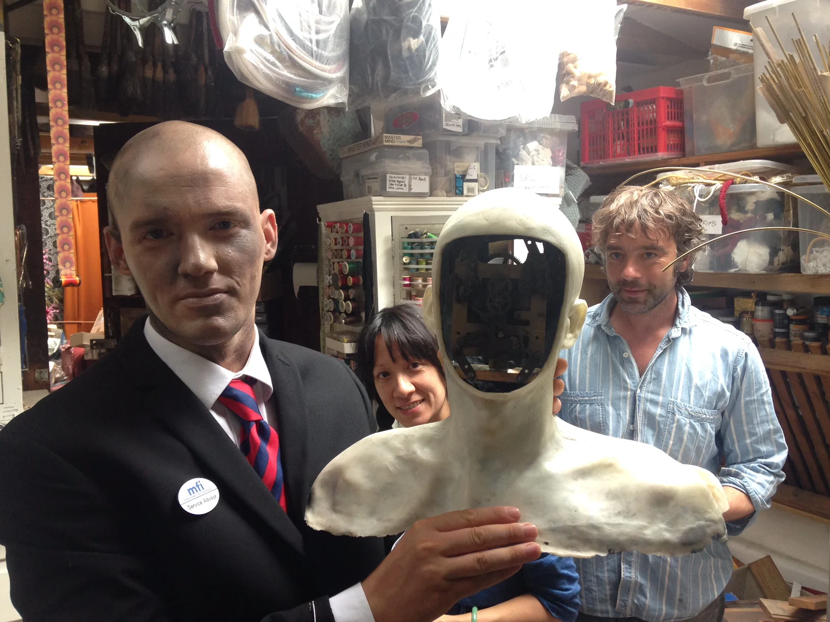 (Left to right, inside Natasha Lawes' studio) Reuben Hollebon, Natasha Lawes, Reuben Hollebon's robot, James Slater
