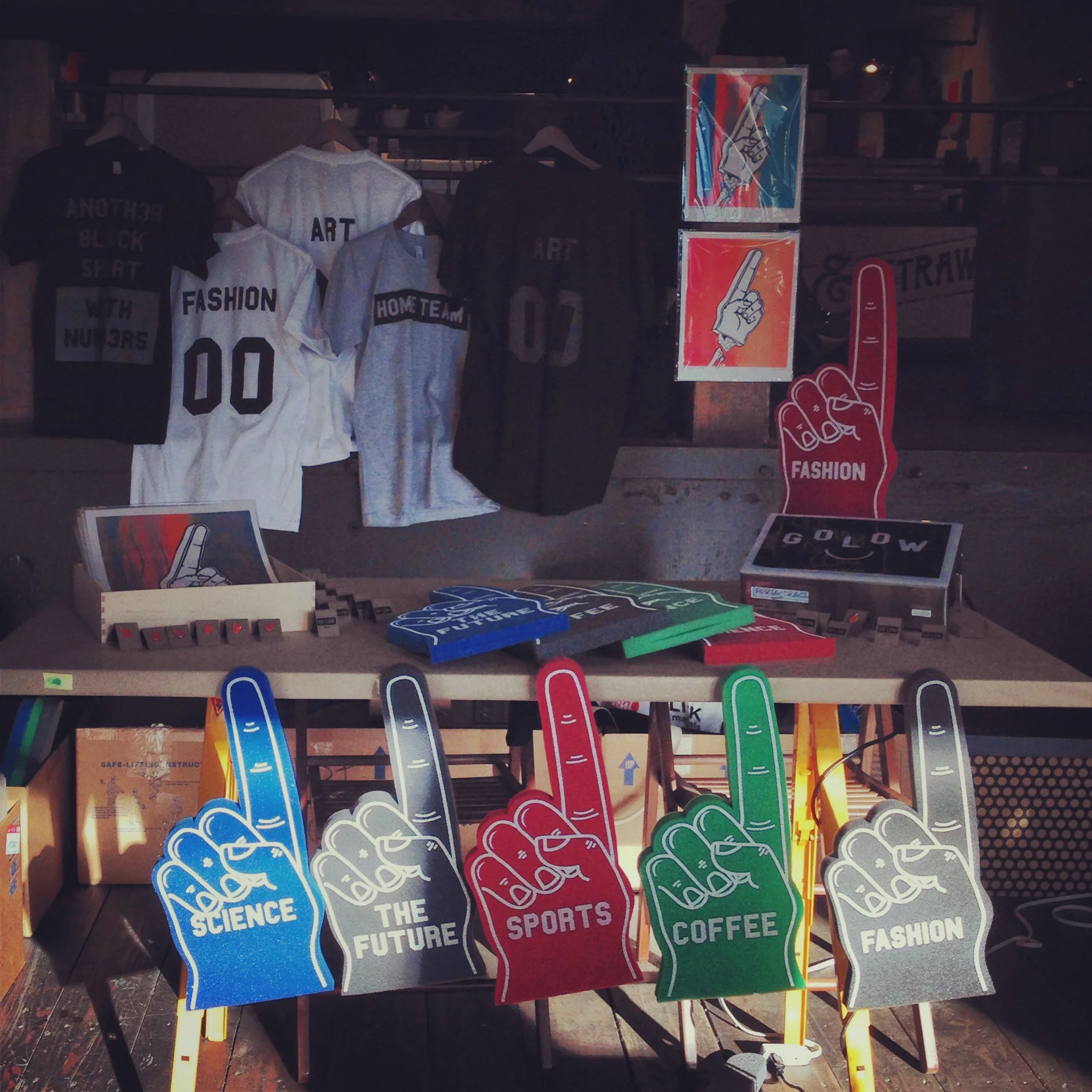 Our range of products sold at a Nike Design pop-up shop. In addition to the foam fingers, we created tees, baseball jerseys, pins and prints.