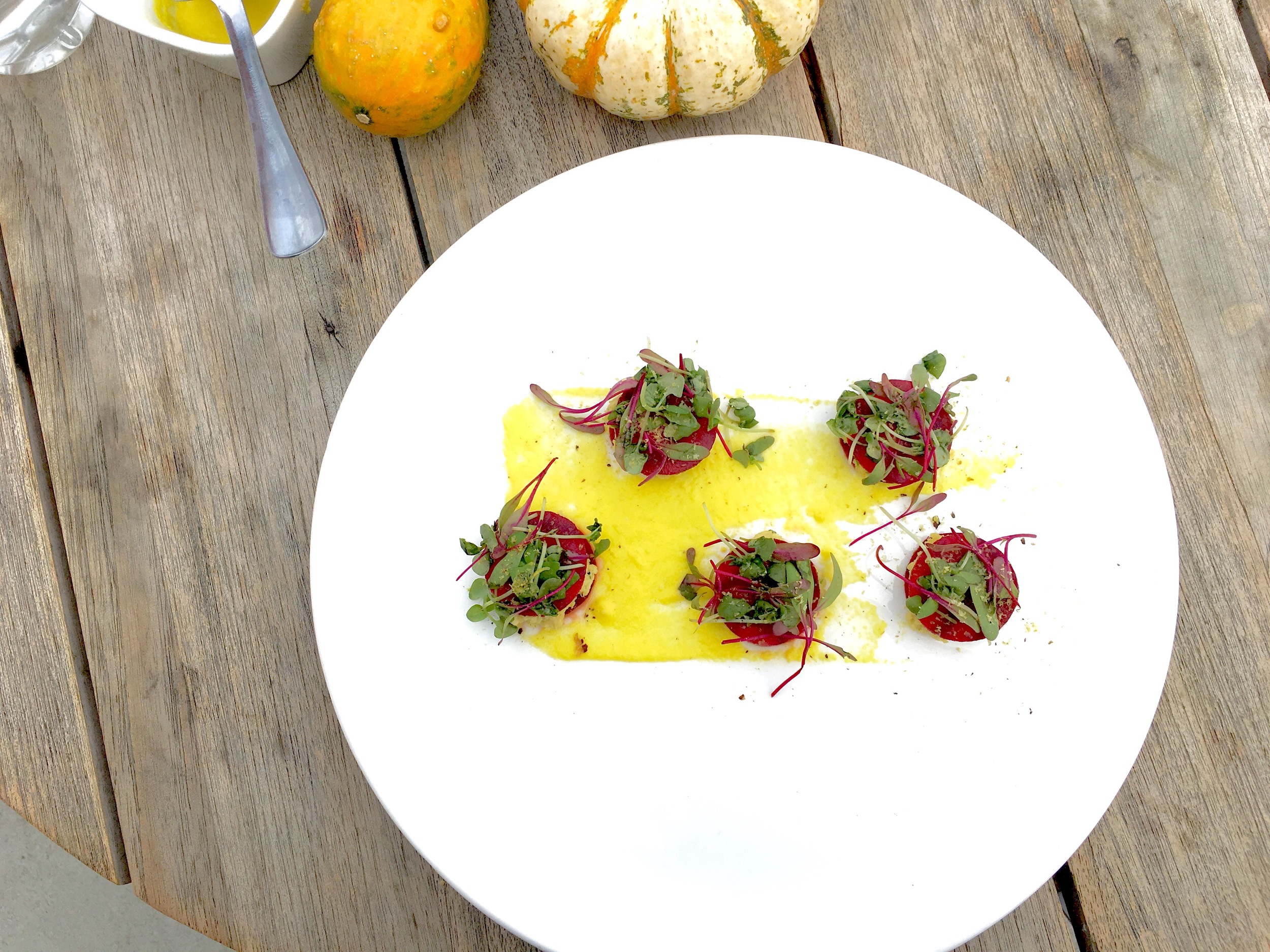 Red beet ravioli // cashew chew, pisatchios, bell pepper puree