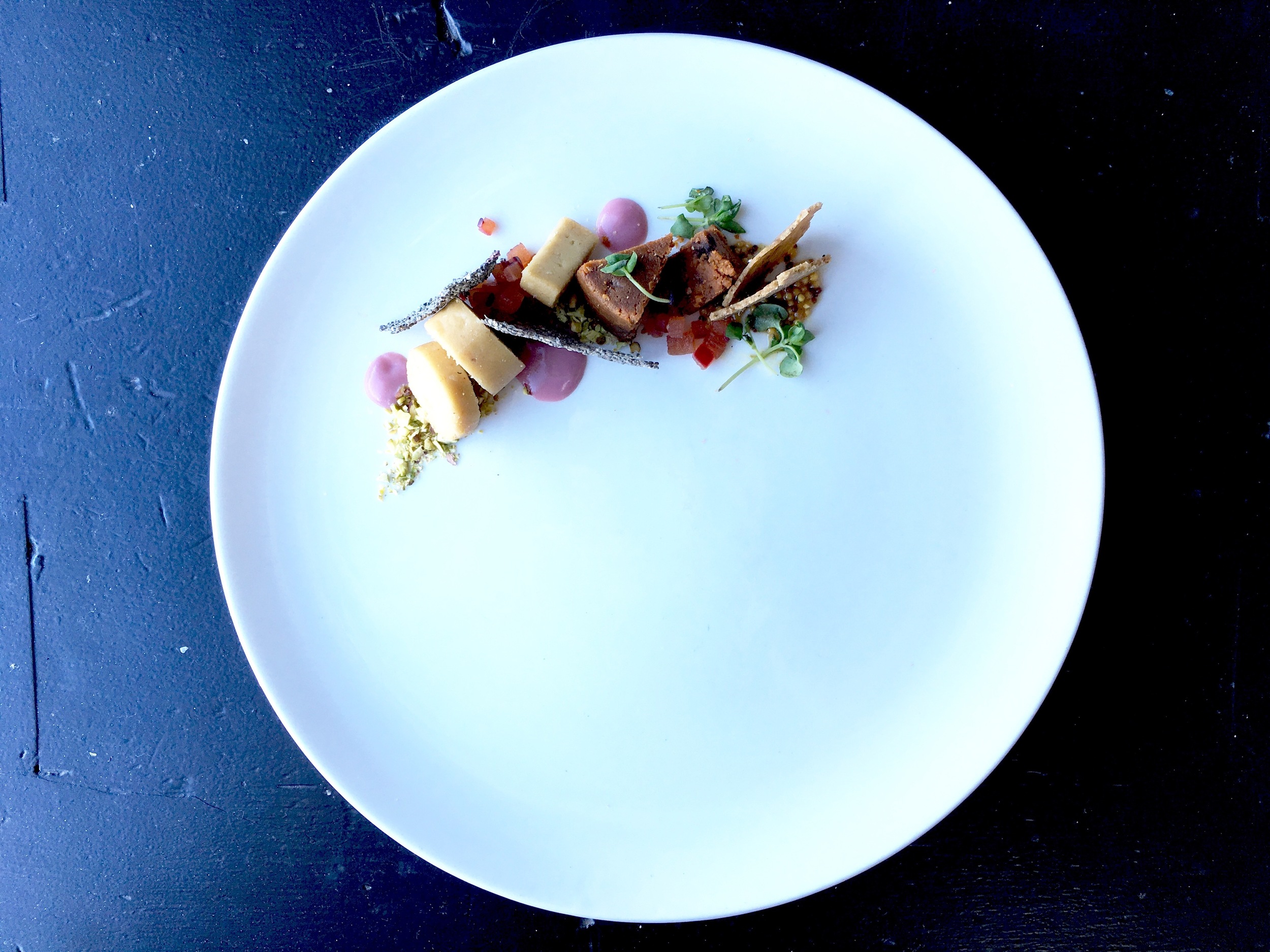 My Cheese Plate // Pistachio crumble / Pomegranate and guava sauce (pink) / Soft onion cheese / Chia seed crackers / Pickled pluot / Sun-dried tomato & black pepper (hard cheese) / Micro basil / Herb Crackers / Mustard Can you tell this plate is a progression of seasons? From spring to autumn (now!). We start off with light tones and flavours, starring beautiful dainty colors of pistachios (green) and sweet guava sauce (pink), which paired nicely with the onion-flavoured soft cheese. The cheese gave a slight kick but was balanced by the soft texture, offering a gentle finish. We then proceed onto the dark side - strong flavours! Hard-rind sun dried tomato cheese worked extremely well with mustard and of course micro basil (textbook stuff!). The choice of buttery herb crackers (Yes you heard me! Vegan crackers can be buttery!) enhanced the flavour combination without being overpowering. That's the breakdown of my plate! Every plate was given much thought and love!