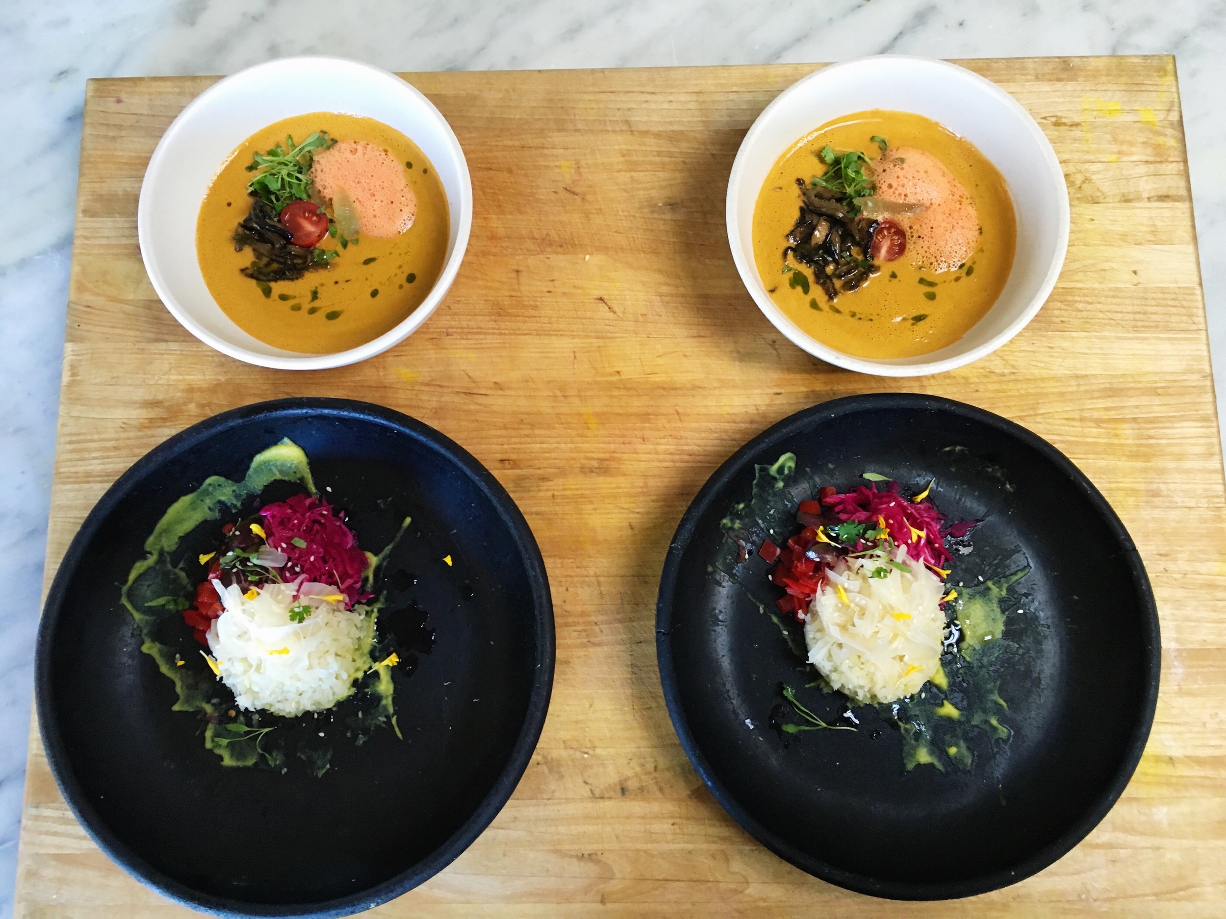 My Final presentation // Raw Tom Yum (top) / Thai Coco Curry. Was in such a hurry for presentations that this is the only picture I took of my babies!! The Tom Yum soup was created with a tomato & coconut milk suit base, raw vegan fish sauce (yes I made that!), lime and lemongrass juice. Marinated shiitake ("fish sauce" and thai green peppers), cilantro oil, micro cilantro and red chili foam to finish. 
