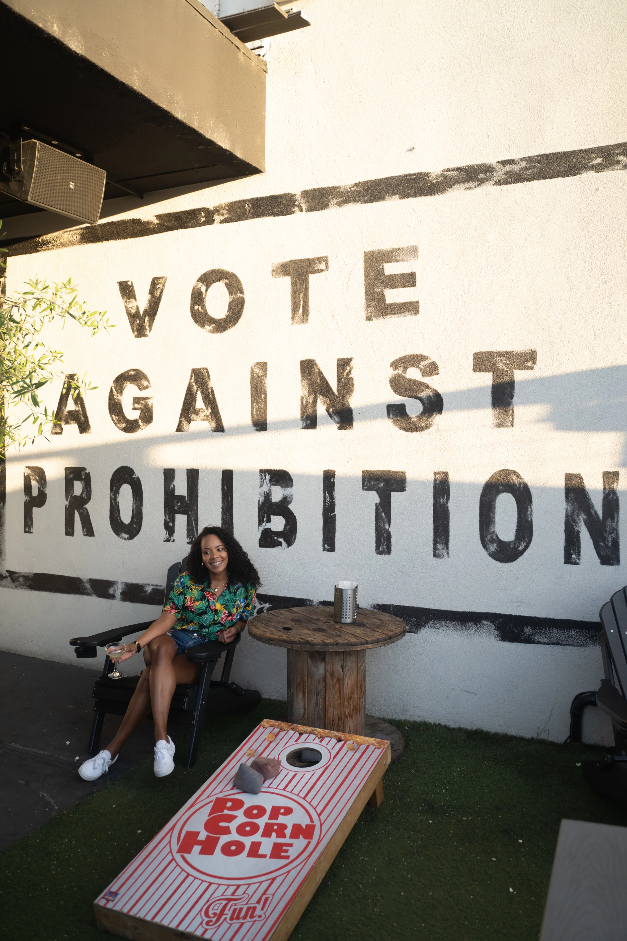 Tiffy posing in front of “Vote against Prohibition” Sign.