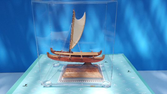 A miniature Hawaiian sailing canoe long by 4"1/2