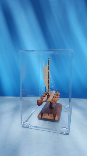 A Hawaiian sailing canoe carved using Koa wood and long by 4"1/2