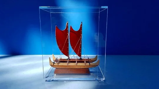Showing the Hokule'a model in its Plexiglas suround.