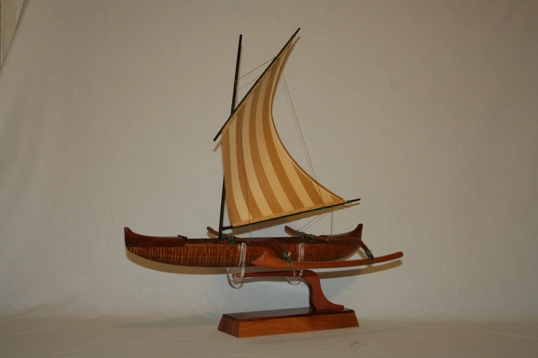  Hawaiian Fishing canoe equipped with a striped lug sail 