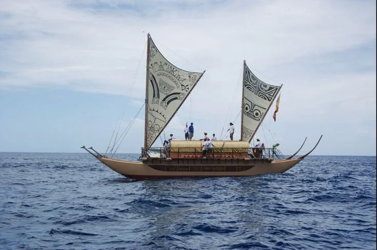  French Polynesian voyaging canoe  sailing near Nuku -Hiva 