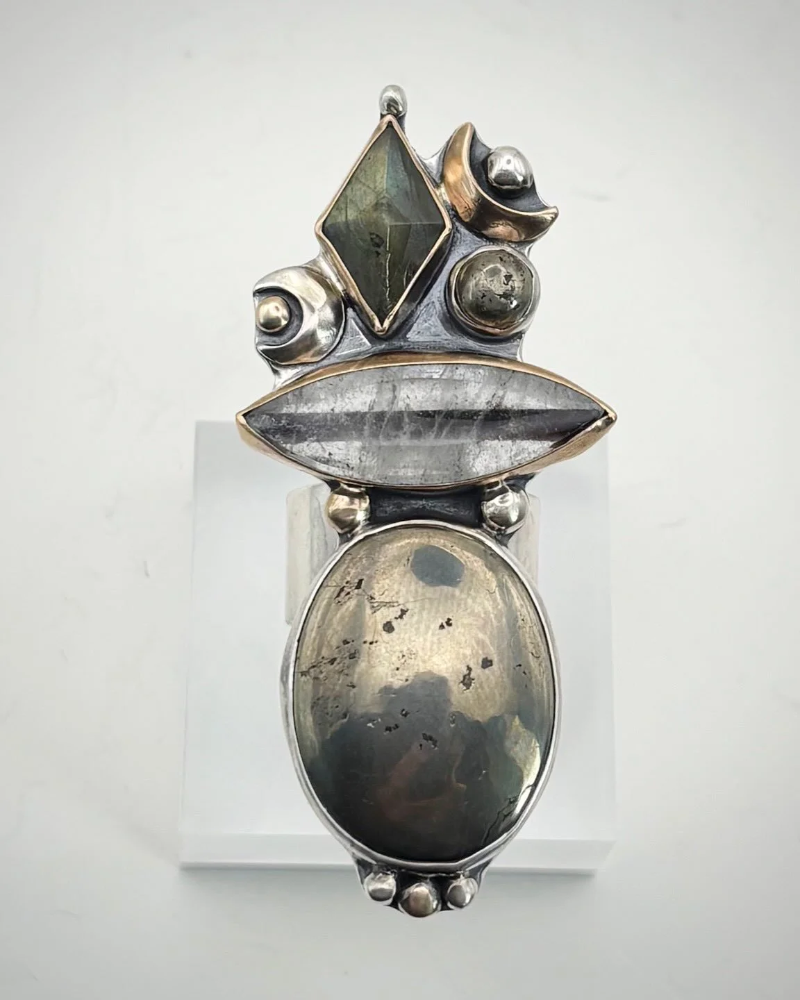 A very unique one of a kind custom ring for a very unique, one of a kind soul @laurendanasmith ✨✨✨

Mixed metal - silver and gold - with Pyrite, Rutilated Quartz and Labradorite and all the moons 🌙

In love with the movement and play in this piece!!