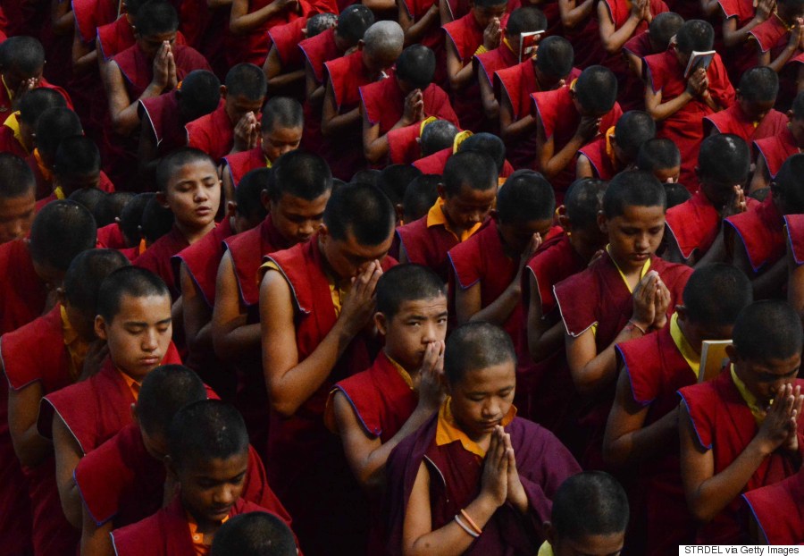 Nepalese novice Buddhist monks offer prayers for earthquake victims at the Bodhgaya Mahabodhi Temple in the Indian town of Bodhgaya on April 26, 2015. (STRDEL/AFP/Getty Images)