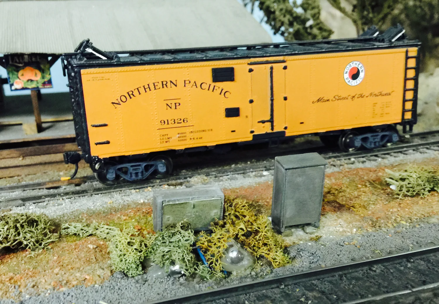 An NP reefer has been unloaded and waits for pickup at Deka Siding. 