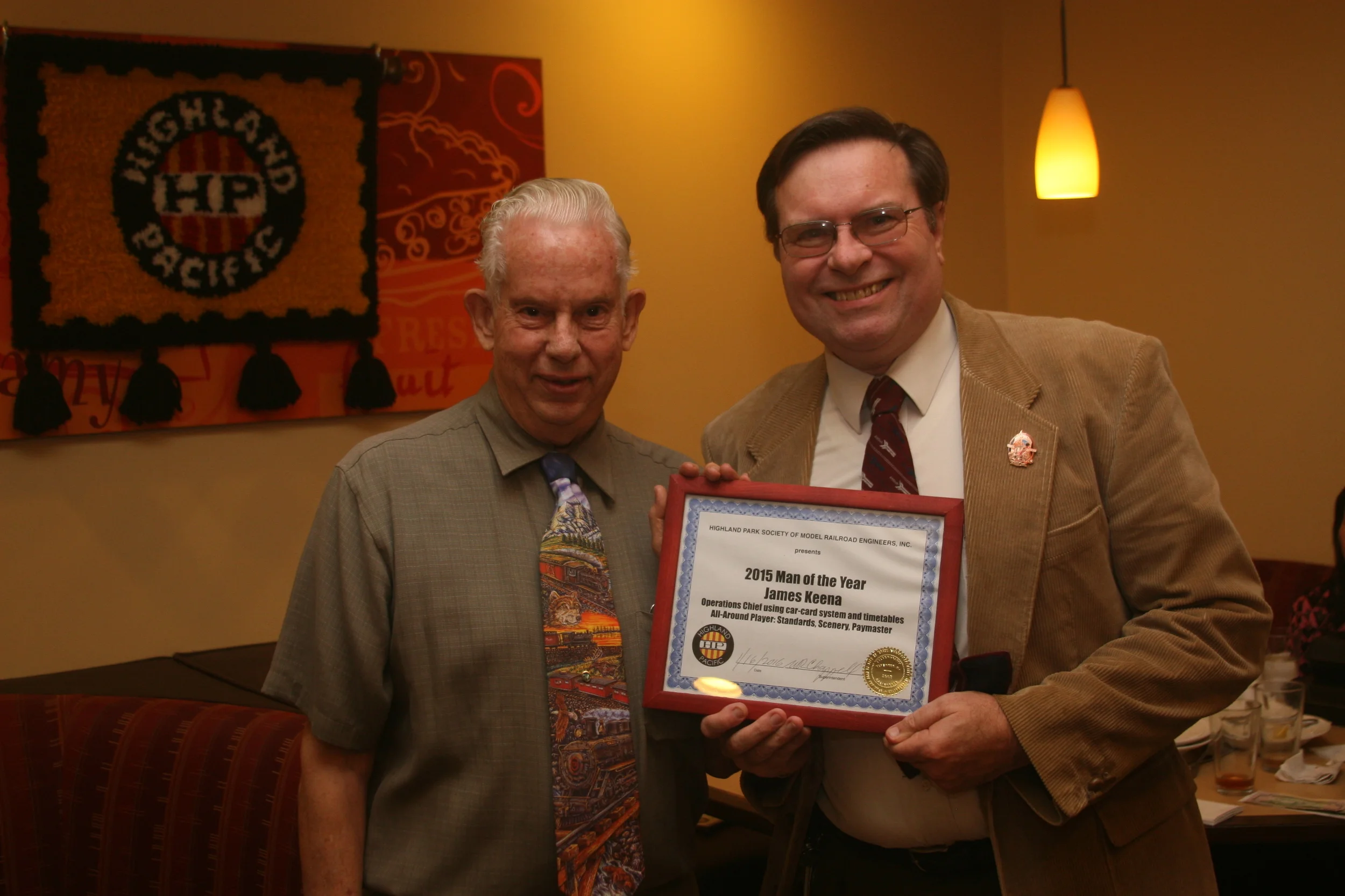 General Superintendent William Chappell presents the 2015 Man of the Year Award to James Keena.