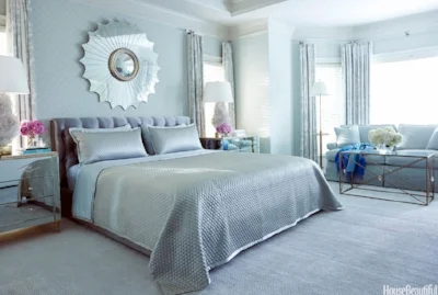 We saw this beautiful smoky blue bedroom in House Beautiful. It was designed by one of our favorite designers, Tobi Fairley, for a client who wanted a little bit of Hollywood glam with a soft and airy color scheme.