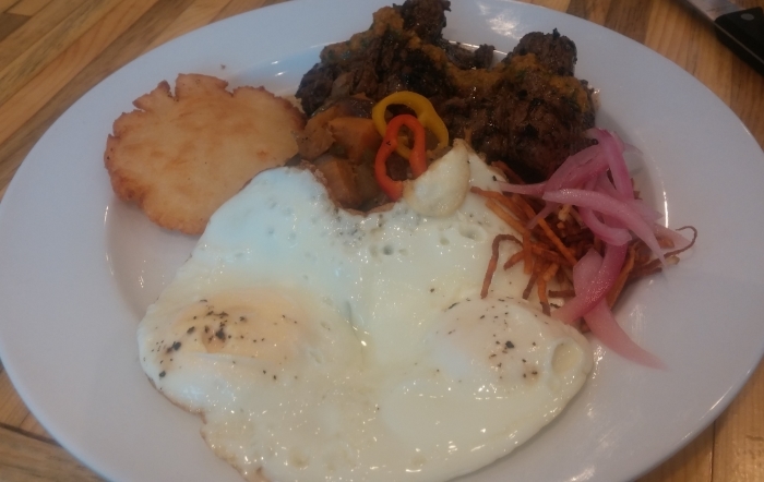 Chimichurri Steak, two Basted Eggs, pillowy Arepa Cake, crispy Frites, Pickled Onions and an Herbaceous Russet-Sweet Potato Hash